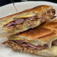 Cuban Sandwich · SERVED ON A GRILLED ROLL WITH VIRGINIA HAM, SALAMI, PULLED PORK,YELLOW MUSTARD, SWISS CHEESE...