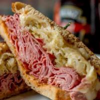 Reuben · LEAN CORNED BEEF, SAUERKRAUT, SWISS, RUSSIAN ON GRILLED RYE