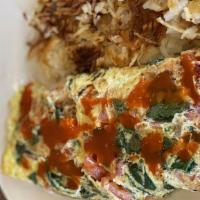 Veggie Omelette · Fresh spinach, onions, green peppers, tomato, mushrooms and Swiss cheese.