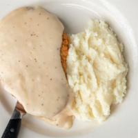 Chicken Fried Steak · Topped with country gravy.