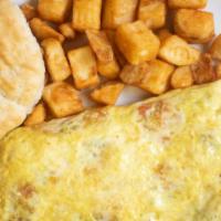 Western Omelette · Three eggs, ham, bell pepper, tomato, onion and cheese.