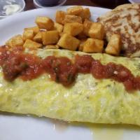 Hangover Omelette · Three eggs, seasoned ground beef, onions, jalapenos, and cheese.