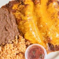 Beef Enchiladas · 3 Ground Beef Enchiladas topped w/beef gravy and melted cheese
