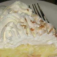 Coconut Cream Pie Slice · Coconut custard with toasted coconut and real  whip cream topping.