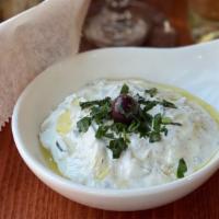 Tzatziki · Greek yogurt, shredded cucumber, garlic, dill, olive oil, vinegar.