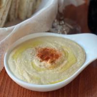 Hummus · Chickpea purée, garlic, tahini, olive oil, lemon juice.