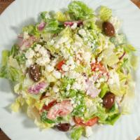 Trapezaria Salad · Romaine lettuce, tomatoes, cucumbers, peppers, kalamata olives, Greek feta, house dressing.