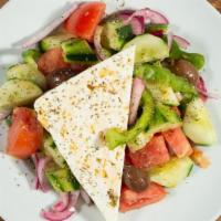 Village Salad · Tomatoes, cucumbers, red onion, Greek feta, green peppers, kalamata olives, olive oil and vi...