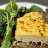Vegetarian Moussaka · Layers of sliced potatoes, zucchini, eggplant, mushrooms,  topped with béchamel sauce, serve...