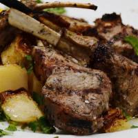 Lamb Chops · Lamb chops  marinated in XVOO, herbs and served with lemon potatoes and broccoli