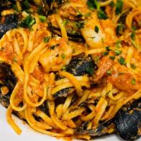Seafood Pasta · Linguini pasta with shrimp, calamari, mussels, tomato sauce, parmesan.