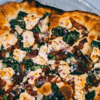 Goat Cheese Pizza · Olive oil, bacon, fig goat cheese, onions and spinach topped with balsamic glaze