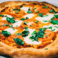 Margherita Pizza · Marinara sauce, fresh mozzarella, tomato and fresh basil