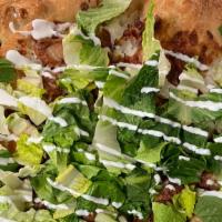 Chicken Bacon Ranch Pizza · Ranch, mozzarella cheese, breaded chicken and bacon with romaine topping