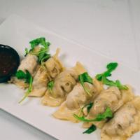 Asian Dumplings · Choose from chicken or pork dumplings served with a side of Sweet Asian Chili sauce