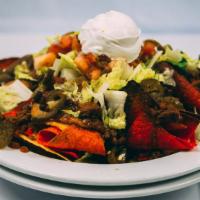 House Nachos · Tri color tortilla chips melted with mozzarella cheese and jalapeno peppers.  Served with si...
