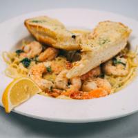 Shrimp Scampi · Shrimp, garlic butter, white wine, fresh basil, linguine and dipping bread topped with grate...