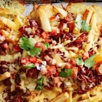 Loaded Fries · Jack & cheddar cheeses melted over a mound of fresh, seasoned fries, topped with applewood s...