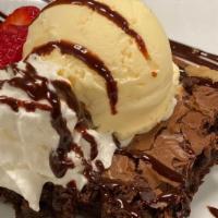 Warm Brownie Sundae · Brownie topped with French vanilla ice cream, whipped cream, toasted almonds, chocolate fudg...