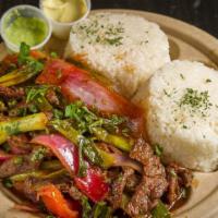 Lomo Saltado · Peruvian stir fry combing marinated beef, red onions, spring onions, tomatoes and cilantro s...