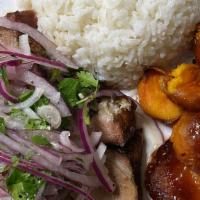 Pernil · roast pork topped with salsa criolla served with sweet potatoes in a grand marnier sauce and...