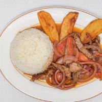 Lomo Saltado · Steak Stir fry with onions, tomatoes, steak fries served with white rice.