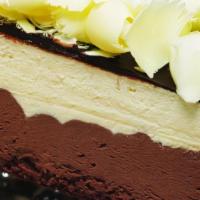 Triple Chocolate Mousse · White and dark chocolate mousse on a sponge base, coated with a chocolate hazelnut glaze and...