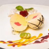 Gelato Exotic · Mango, passion fruit and raspberry sorbetto, all covered in white chocolate and drizzled wit...