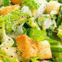 Caesar Salad · Romaine hearts lettuce, parmesan cheese, caesar dressing.