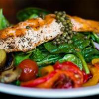 Grilled Salmon Nicoise Salad · Spinach, potatoes, roasted peppers, egg, tomatoes, capers, olives, red onions in an anchovy-...