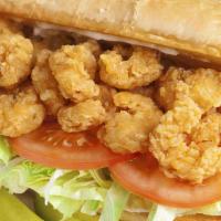 Fried Shrimp Po Boy · Freshly made sandwich consisting of breaded shrimp and toppings, served on a baguette.