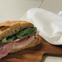 Porchetta · Porchetta, basil, sundried tomatoes and ricotta.