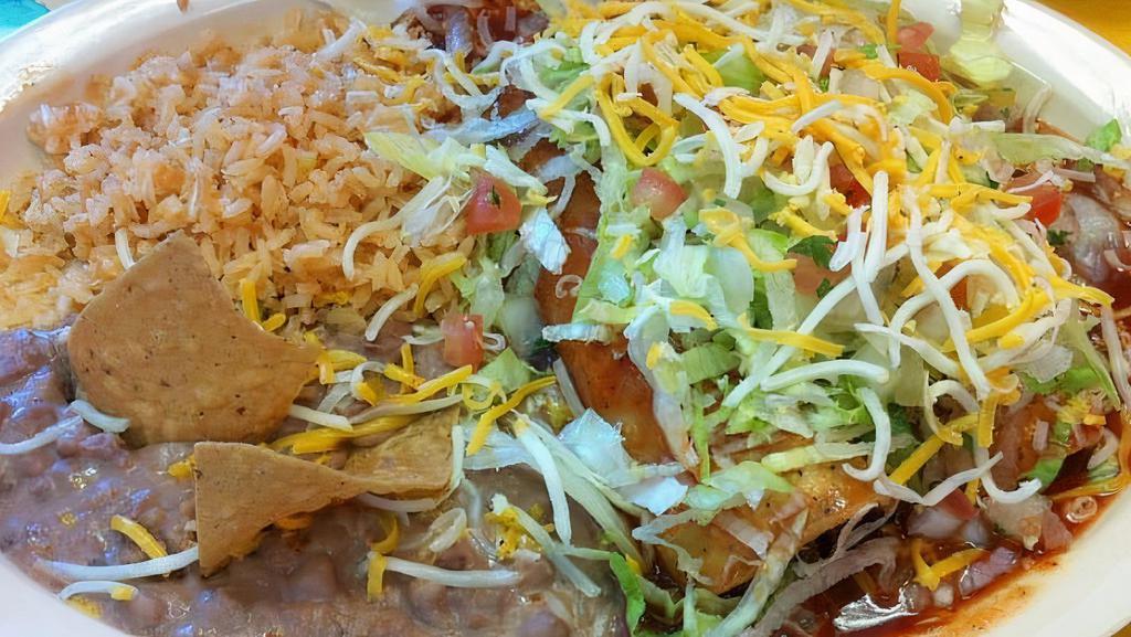 (2) Mixed Enchilada · two Beef and beans enchiladas with enchilada sauce on top, lettuce, pico de gallo and cheese.