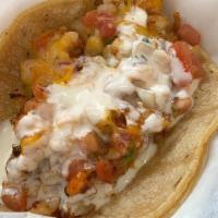 Lobster Taco · grilled lobster, salsa fresca, withe sauce and cheese.