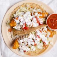 Fish Taco · Fried in beer batter, cabbage, salsa fresca and white sauce.