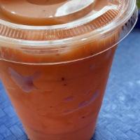 Tropical Squeeze Smoothie · Guava, strawberry juice, pineapple juice, and low fat orange sherbet.