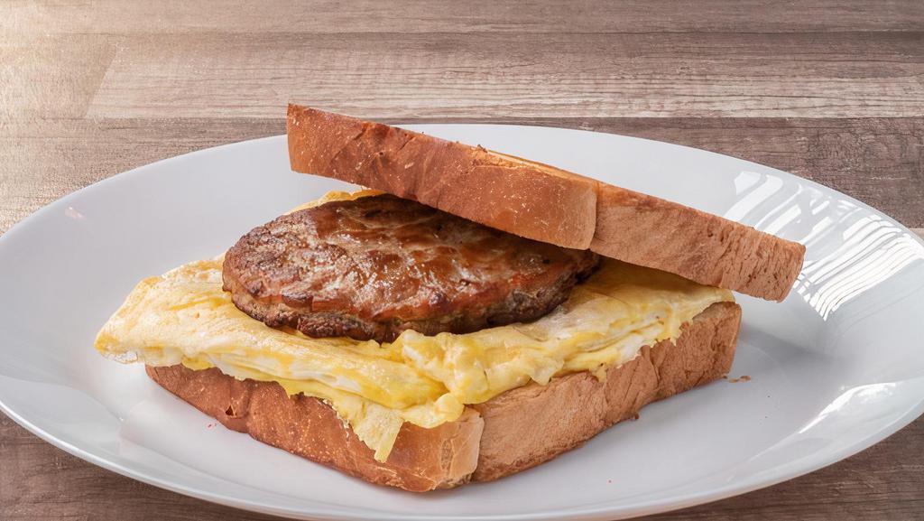 Sausage Eggs Sandwich · Comes with 2 eggs scramble, sausage & choice of white or wheat bread.