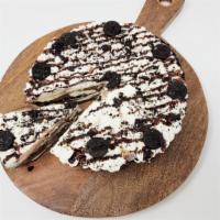 Oreo Custard Pie · A whole custard pie, homemade in our store. Oreo crust, vanilla and chocolate swirl custard,...