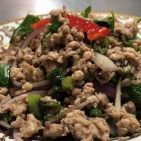 Larb** · Thai spicy. Grounded chicken, hot peppers, shallot, mint, lime juice, fish sauce and lettuce...