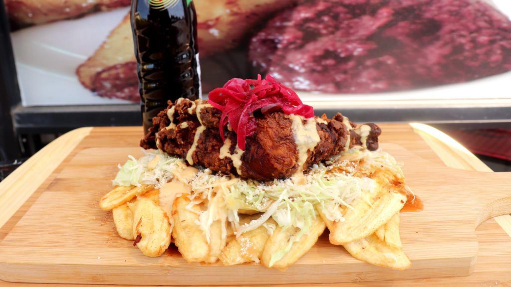 Tajadas De Guineo, Platano O Maduro · Fried plantain of choice topped with meat of choice, cabbage, special sauce, and special dressing.