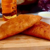 Empanadas · Ground corn dough stuffed with choice of filling with special sauce.