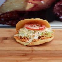 Arepas · Ground corn dough with choice of filling topped with cabbage, special sauce, and special dre...