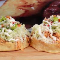 Sopes (2) · Corn dough topped with refried beans and choice of meat, cabbage, pico de gallo, pickled oni...