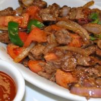 Lega Tibs · Mediium juicy cubed lamb or beef cooked with onions,
jalapeno, and Ethiopian spices