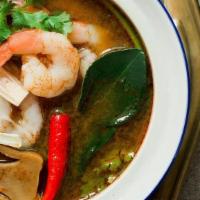 Poh Taek (Seafood Soup) · Variety of seafood in spicy savory broth flavored with Thai herbs.