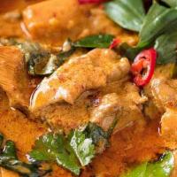 Red Curry · Spicy coconut milk with fresh sweet basil leaves, bamboo shoots and bell peppers. Served wit...