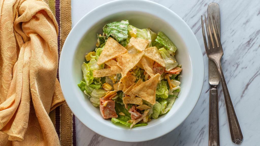 Santa Fe Salad · Tender grilled chicken with our Cajun seasonings, fresh mixed greens, tomatoes and red onions with roasted corn, mixed cheddar and jack cheese, crispy tortilla chips and ranch dressing.