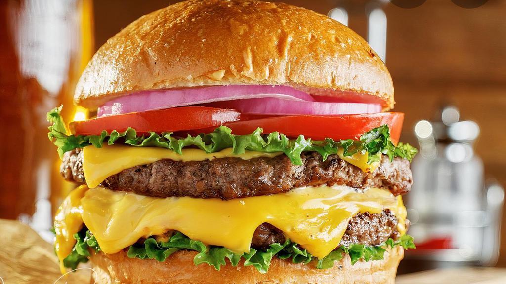 Double Bacon Cheeseburger · Our double bacon cheese burger comes with two hand crafted 100% fresh beef patties served with American cheese, onions, double bacon, tomatoes, pickles and lettuce.