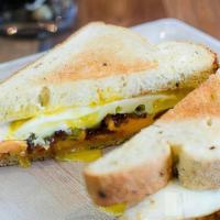Tx Cackleberry Sammy Combo · Two fried eggs, applewood bacon, and spicy pimiento cheese on jalapeno toast. Served with ch...