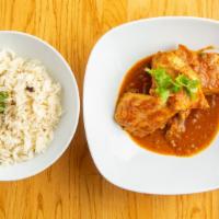  Malabar Fish Curry · Salmon cooked in coconut sauce W/ mustered ,curry leaf , onions and spices .